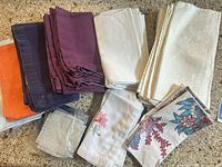 Group view of assorted napkins in various colors and patterns placed on countertop