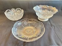 Three clear glass serving bowls arranged together