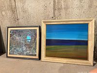 Front view of both framed artworks side by side