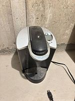 Front and top view of Keurig coffee maker showing overall form and condition