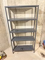 full view of metal rack showing five shelves