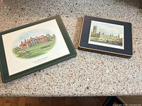Large and small placemats showing building illustrations, borders, and surface condition