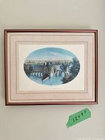 Framed print on wall with frame and mat visible