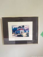 Front view of framed artwork showing image, mats, and frame