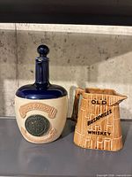 Front view of King’s Ransom decanter and Old Bushmills jug side by side