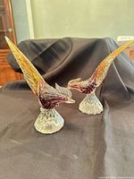 Both Murano glass pheasant figurines side by side