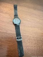 Front view showing full watch, dial, strap and clasp