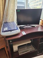 Dell monitor, HP scanner and printer together on desk