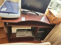 Front view of desk showing top, raised shelf, monitor and scanner (contents not included)