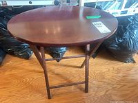 Full view of folding wood side table