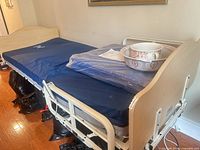 Full view of bed showing mattress, side rails, headboard, footboard