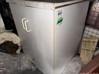 Two-door white base cabinet with laminate countertop, front view