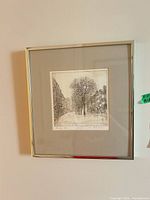 full view of framed etching on wall