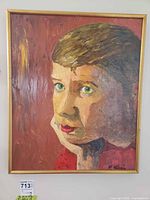 Front view of framed oil portrait showing signature