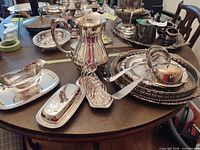 Group of pitcher, gravy boat, toast rack, trays, ladles