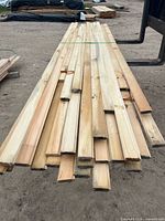 Stack of pine boards showing length and quantity