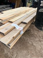 Stack of weathered 1" x 5" V-joint boards on pallet