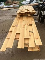 Full stack of white pine 1x6 log siding boards on forklift