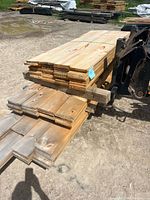 Stacked bundle of white pine boards on forklift
