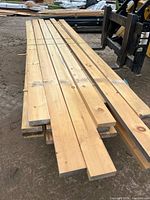 Stack of 2x6 dressed pine boards strapped together