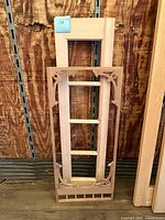 Maple door frame leaning against wall with cedar insert in front