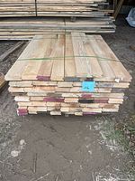 Front view of strapped stack of tongue & groove boards