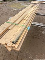 Top view of bundled maple boards strapped together
