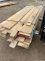 Full view of strapped bundle of maple boards