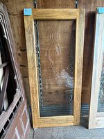 Front view of pine framed glass door with etched glass insert