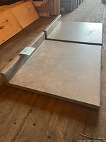 Both countertop sections side by side showing surface and backsplash