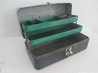 Box open showing green cantilever trays