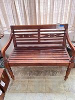 Full view of wood bench front angle