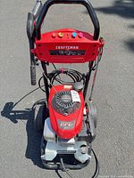 Full view of pressure washer with accessories attached