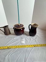 Front view showing jar with lid and pitcher