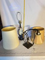 Group view of ceramic table lamp, metal desk lamp and fabric shade