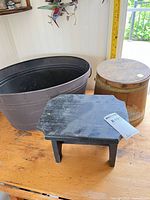 all three items together—footstool, wooden canister, metal tub