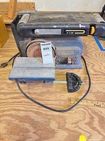 Front view of Ryobi belt/disc sander with miter guide visible