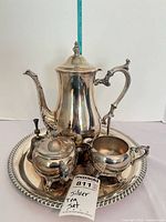 Full tea set arranged on tray showing all pieces