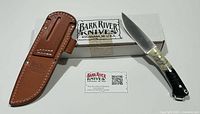Knife, sheath, box, info card group shot