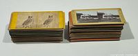 Two stacks of stereoview cards, front views showing owl image and farm scene