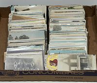 Carton filled with organized rows of postcards