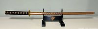 Full view of sword on stand