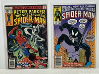 Both comic books in bags and boards, front covers visible