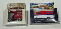 Front view of both boxed die-cast vehicles showing graphics and models