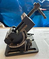 Overall side view showing tilting mechanism, base, screw and handle