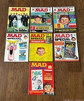 Group shot of seven MAD magazines showing all covers