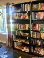 Front view of two bookcases, left unit part of lot