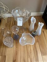 All eight glass items grouped on floor