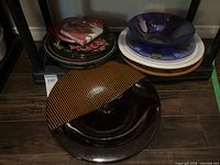 Overall view of stacked plates and bowls on shelf