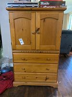 Front view closed showing full armoire
